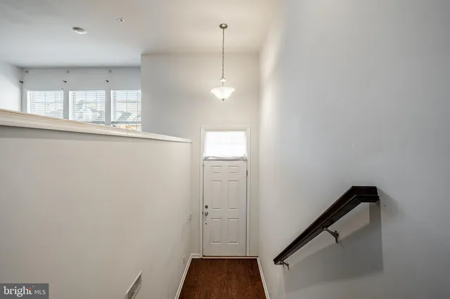 a large kitchen with granite countertop a large counter top stainless steel appliances and a sink
