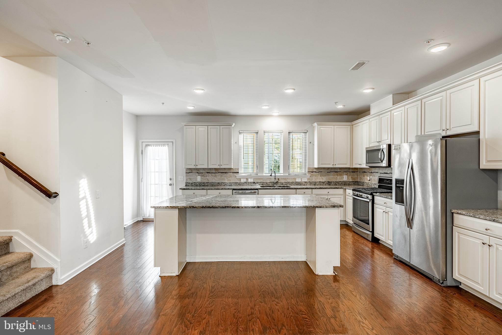 33 Addison Lane Malvern, PA 19355 - Photo 6 of 32 a kitchen with stainless steel appliances granite countertop a refrigerator and a stove top oven
