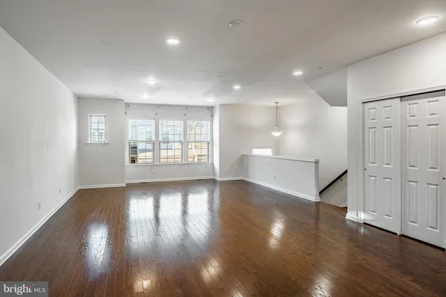 a view of kitchen dining table chairs microwave and cabinets