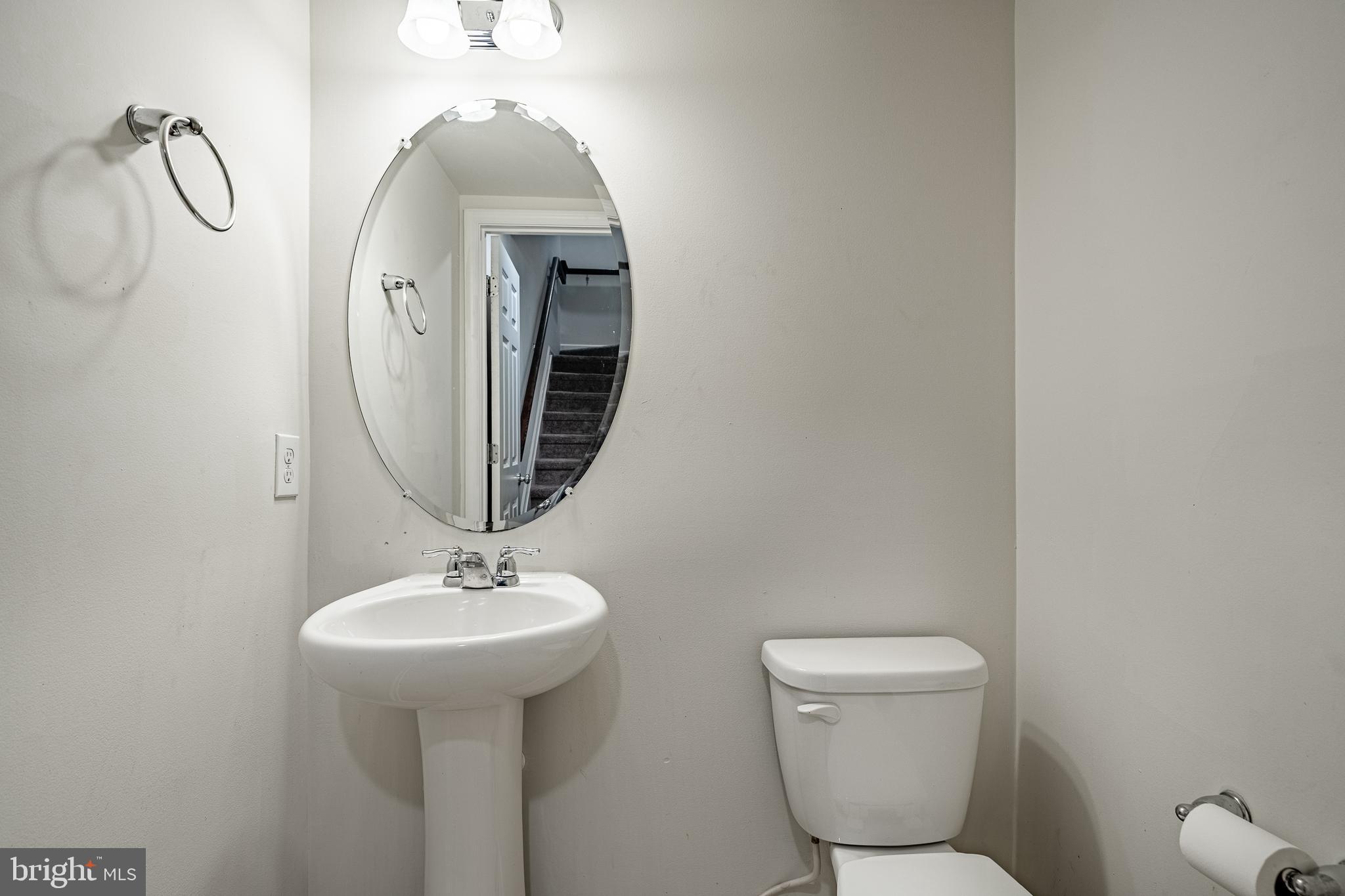 33 Addison Lane Malvern, PA 19355 - Photo 9 of 32 a bathroom with a toilet sink and mirror