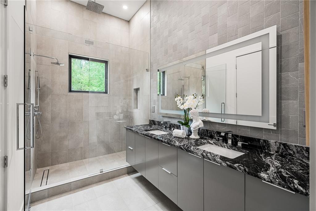 19 Spruell Springs Road Atlanta, GA 30342 - Photo 15 of 36 a bathroom with a sink and a mirror