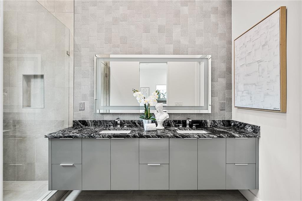 19 Spruell Springs Road Atlanta, GA 30342 - Photo 16 of 36 a bathroom with a sink and a mirror
