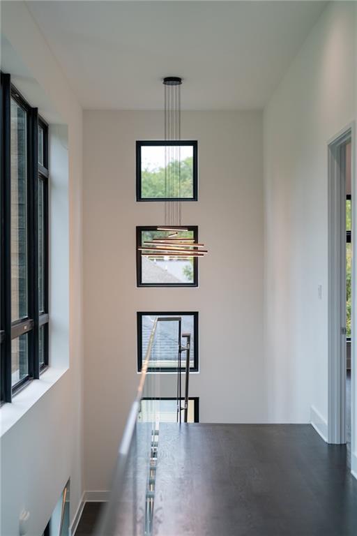 19 Spruell Springs Road Atlanta, GA 30342 - Photo 18 of 36 a view of a livingroom with wooden floor and a flat screen tv