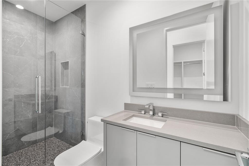 19 Spruell Springs Road Atlanta, GA 30342 - Photo 24 of 36 a bathroom with a sink toilet and shower