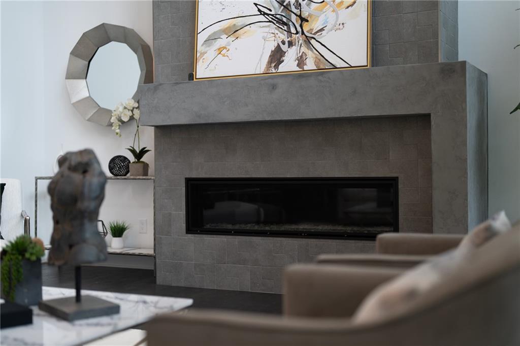 19 Spruell Springs Road Atlanta, GA 30342 - Photo 5 of 36 a living room with furniture and a fireplace