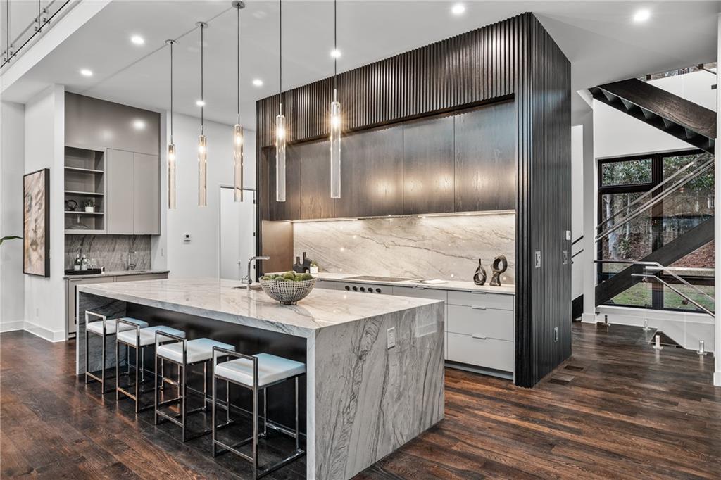 19 Spruell Springs Road Atlanta, GA 30342 - Photo 8 of 36 a kitchen with kitchen island cabinets and wooden floor