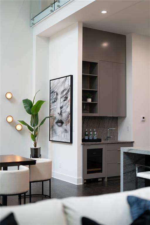 19 Spruell Springs Road Atlanta, GA 30342 - Photo 9 of 36 a living room with furniture a flat screen tv and a potted plant