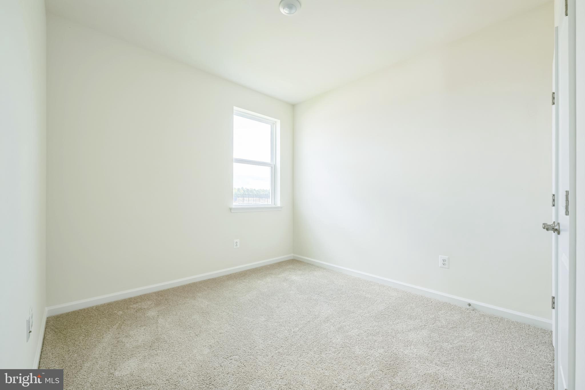 24755 Michael Isler Avenue Millsboro, DE 19966 - Photo 14 of 14 an empty room with windows
