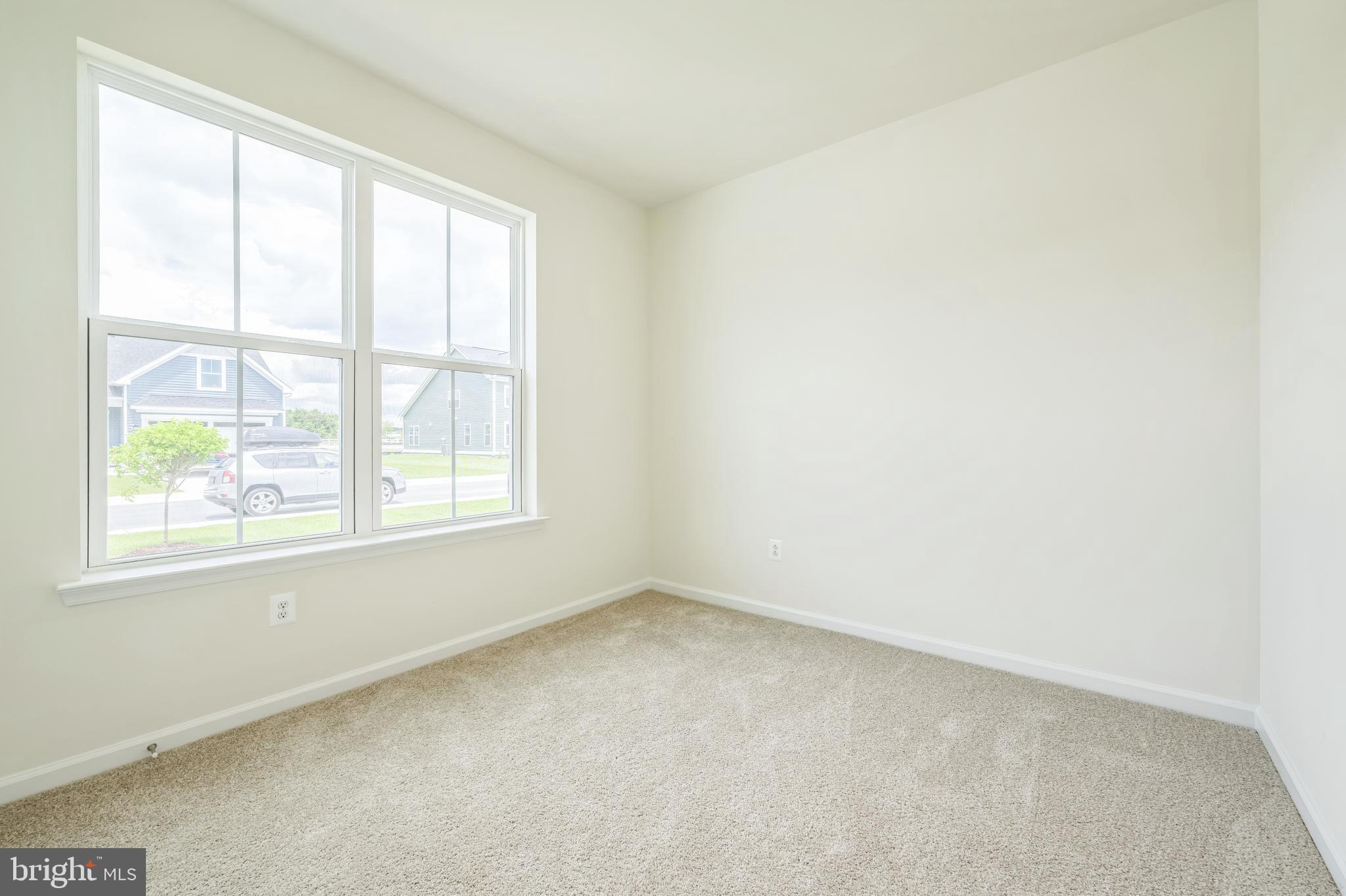 24755 Michael Isler Avenue Millsboro, DE 19966 - Photo 2 of 14 an empty room with a window