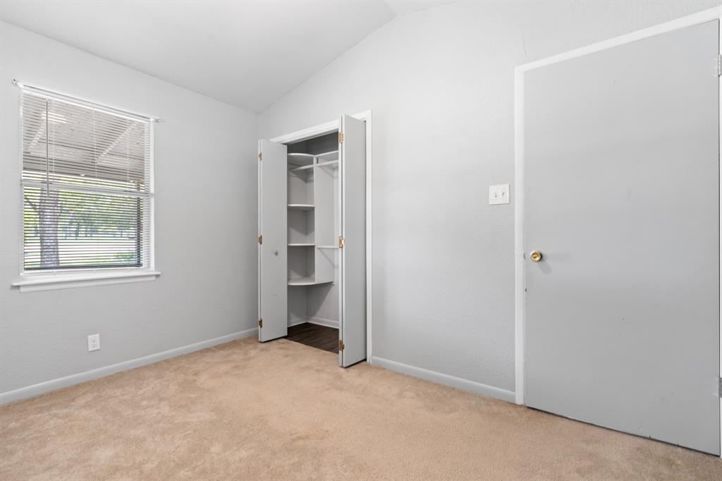 235 Country Drive Waco, TX 76705 - Photo 12 of 29 a view of an empty room with a window