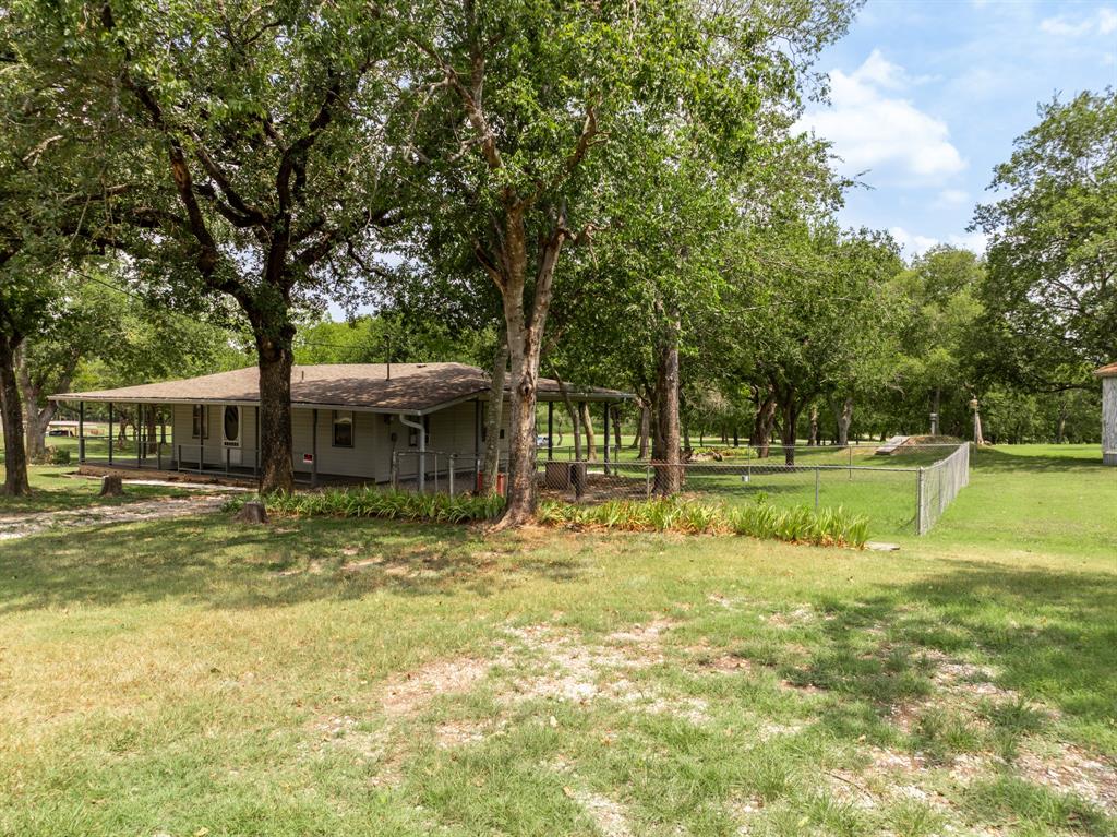 235 Country Drive Waco, TX 76705 - Photo 15 of 29 a view of a house with a yard