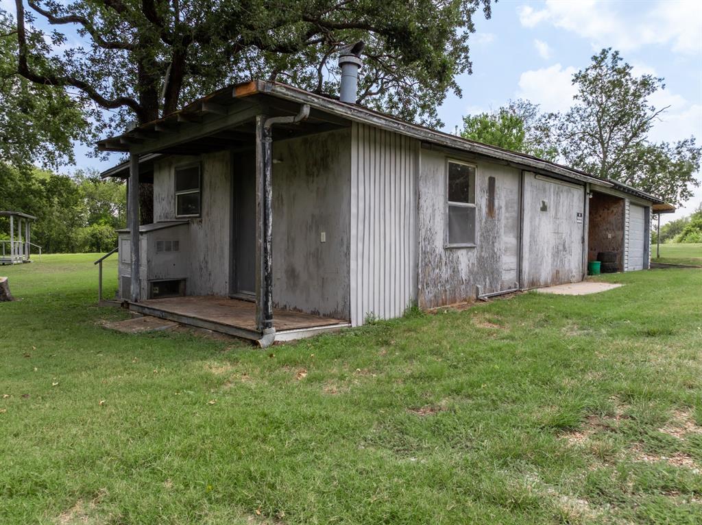 235 Country Drive Waco, TX 76705 - Photo 21 of 29 a backyard of a house with lots of green space