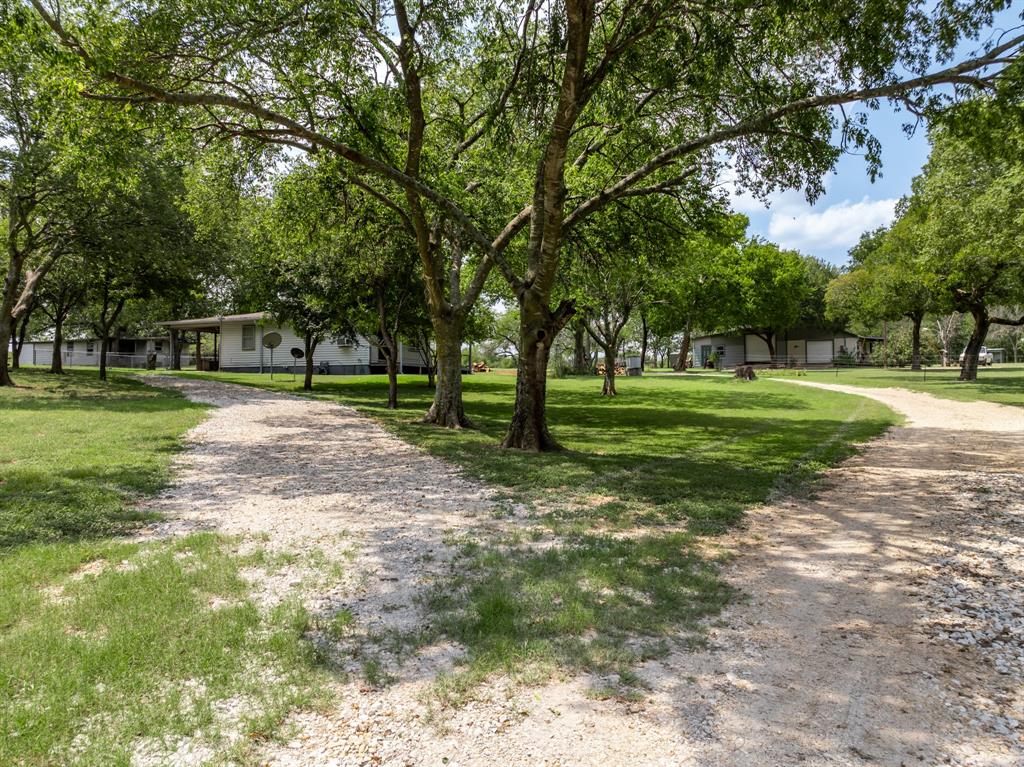 235 Country Drive Waco, TX 76705 - Photo 23 of 29 a view of a park with trees and grass
