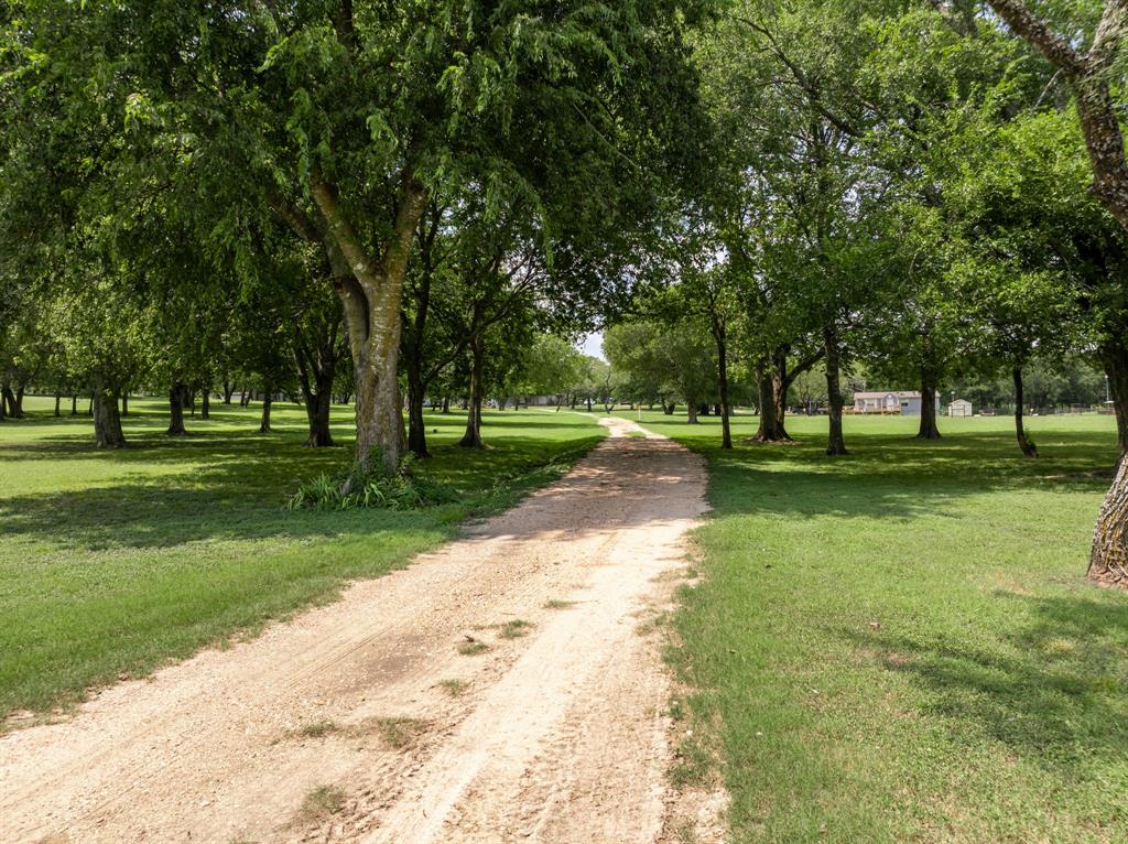 235 Country Drive Waco, TX 76705 - Photo 24 of 29 a view of a park with tree s