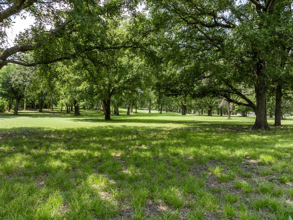 235 Country Drive Waco, TX 76705 - Photo 26 of 29 a view of a park with trees and grass