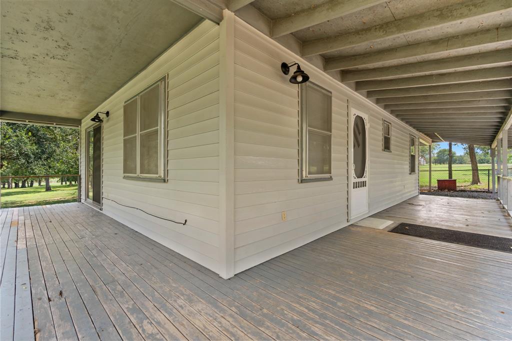 235 Country Drive Waco, TX 76705 - Photo 4 of 29 a view of a porch with wooden floor