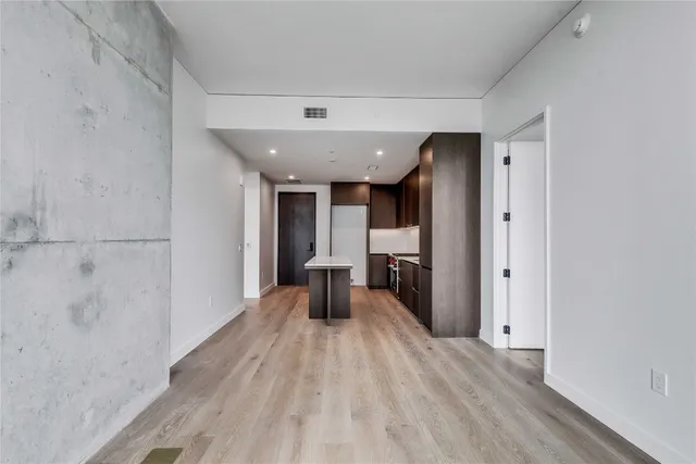 a view of a living room and hallway with wooden floor