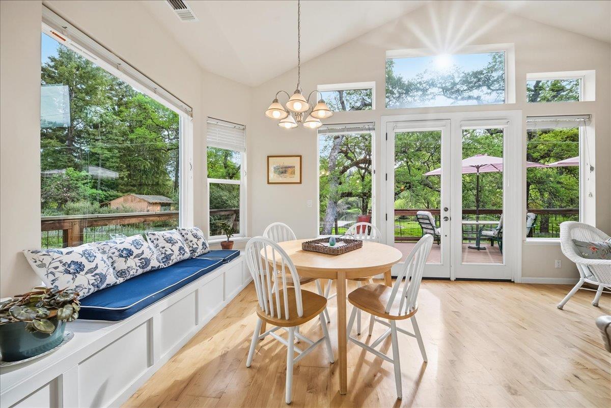 709 Cole Road Meadow Vista, CA 95722 - Photo 1 of 57 a view of a dining room with furniture large windows and wooden floor