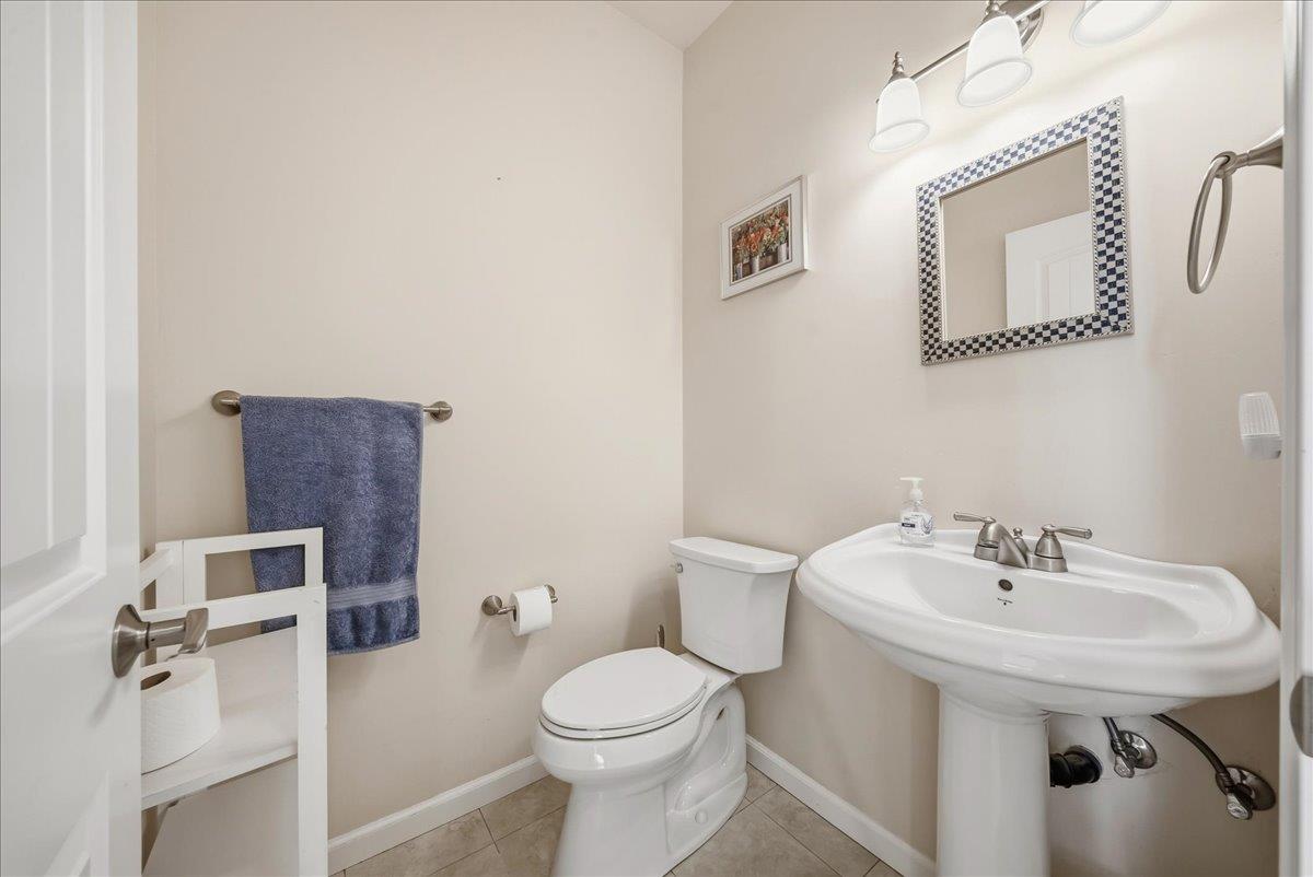 709 Cole Road Meadow Vista, CA 95722 - Photo 11 of 57 a bathroom with a toilet a sink and mirror