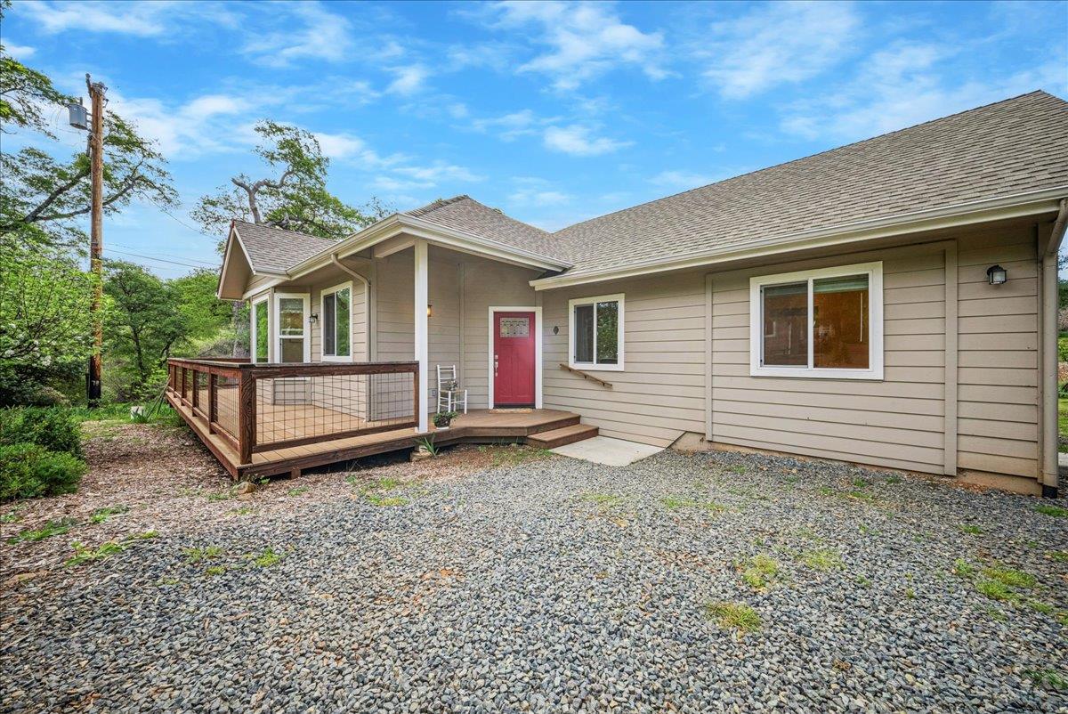 709 Cole Road Meadow Vista, CA 95722 - Photo 17 of 57 a front view of a house with a yard