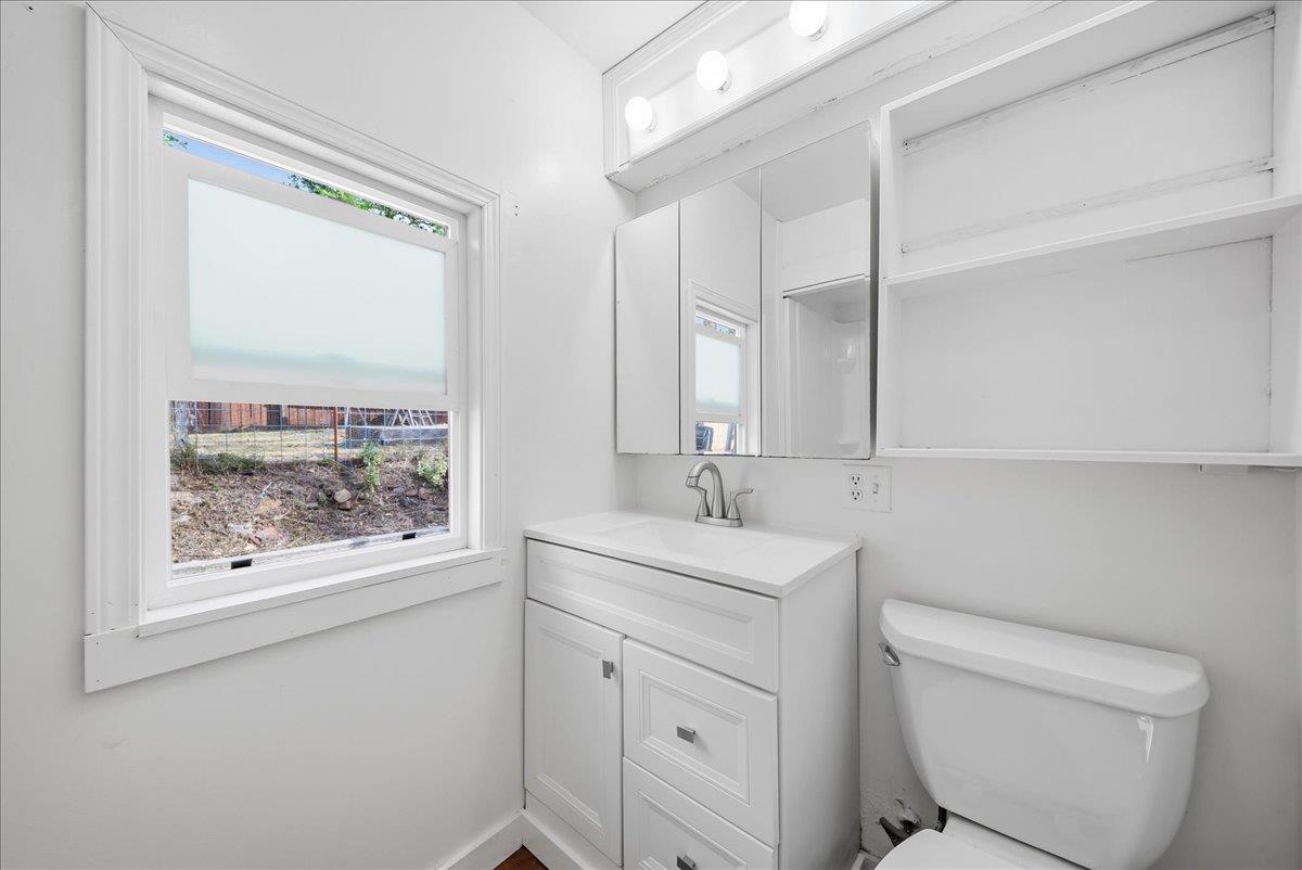 709 Cole Road Meadow Vista, CA 95722 - Photo 46 of 57 a bathroom with a toilet sink and mirror