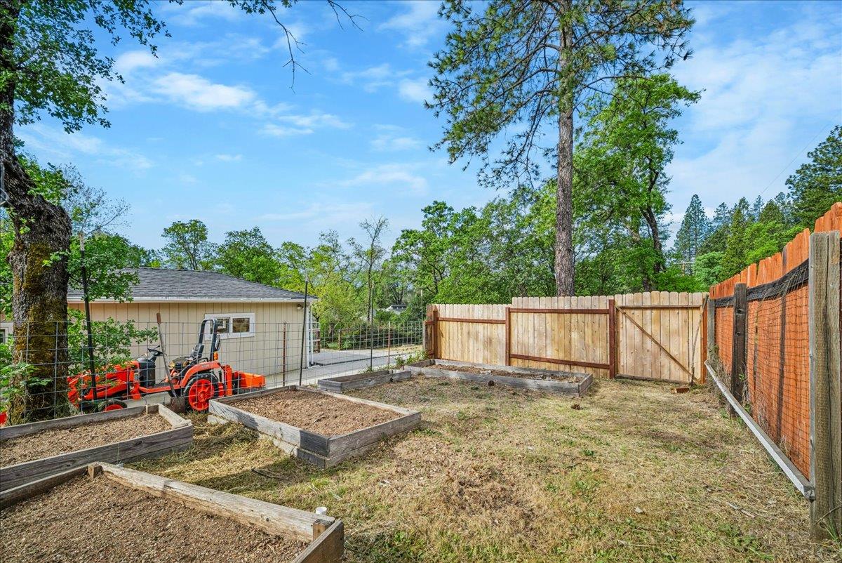 709 Cole Road Meadow Vista, CA 95722 - Photo 50 of 57 a view of a house with backyard and sitting area