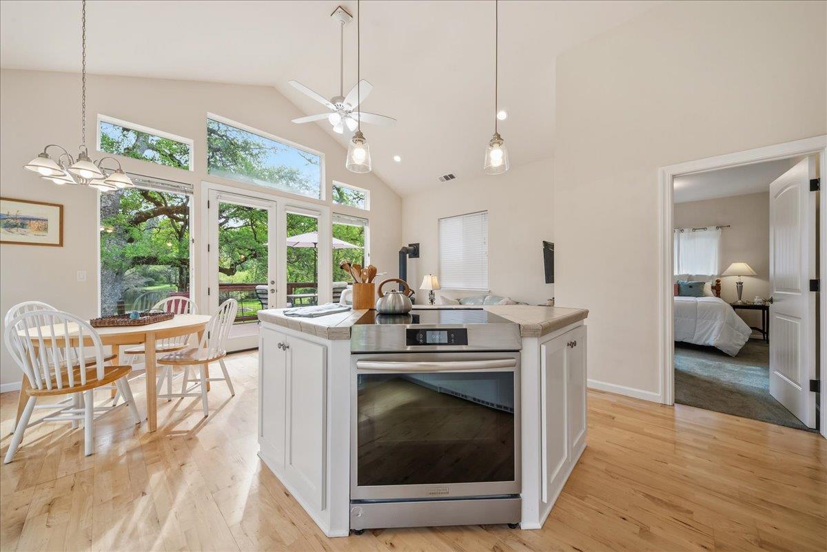 709 Cole Road Meadow Vista, CA 95722 - Photo 7 of 57 a kitchen with stove and wooden floor