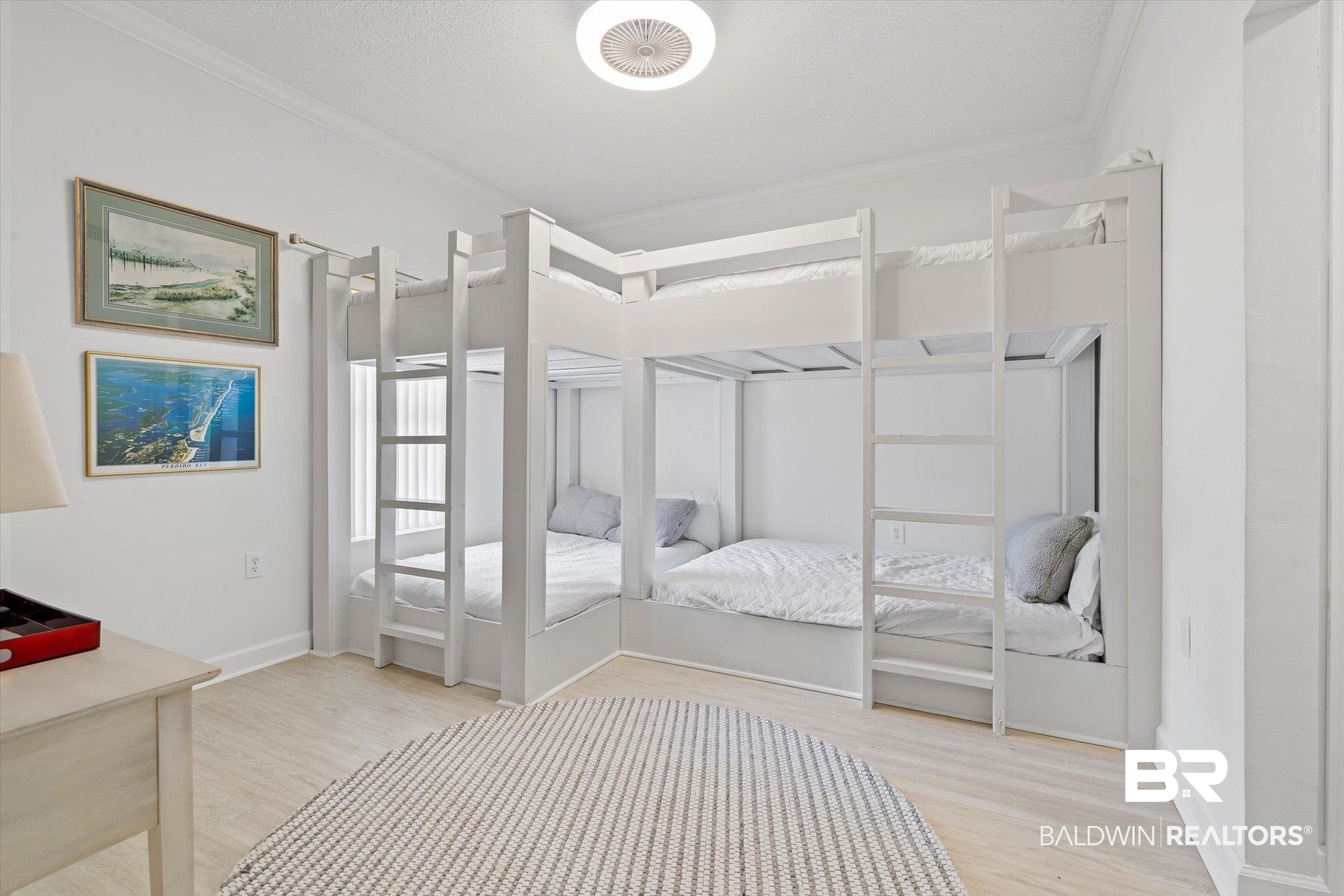 27770 Canal Road, Unit 2102 Orange Beach, AL 36561 - Photo 11 of 19 Bedroom featuring light wood finished floors and crown molding