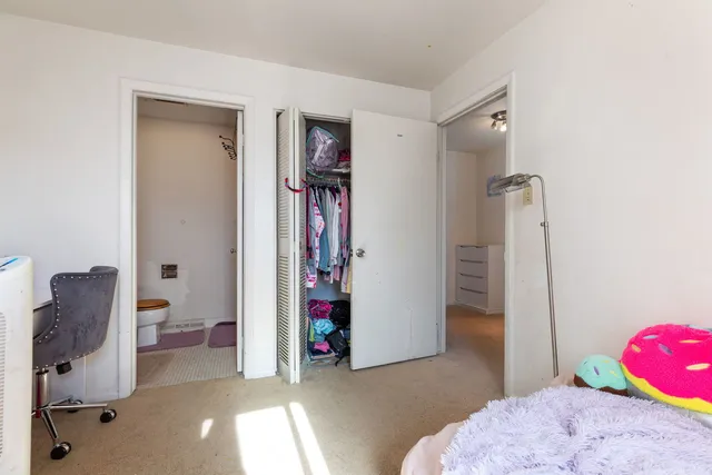 a view of room with furniture and closet