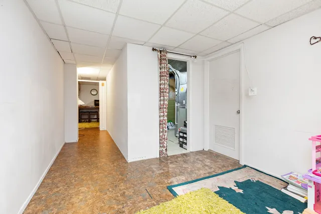a view of hallway with wooden floor