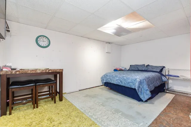 a bedroom with a bed and a table in it