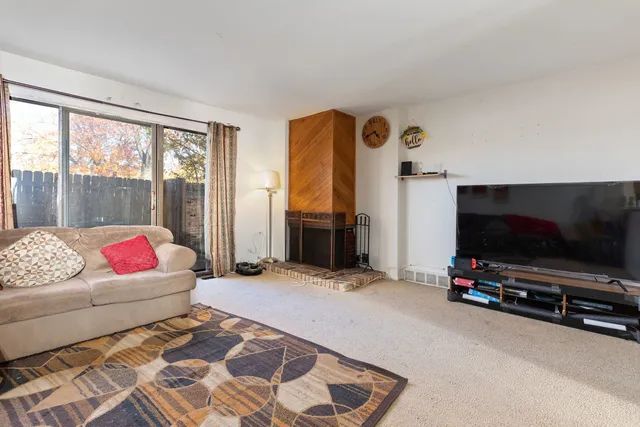 a living room with a couch and a flat screen tv