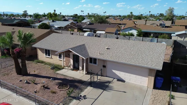 a view of a house with roof deck and seating space