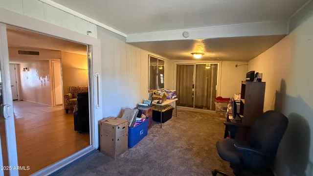 a room with furniture and a view of living room