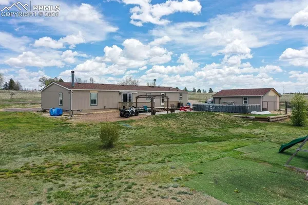a view of a house with a big yard