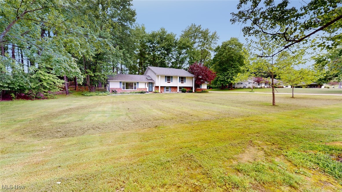 View of front of house featuring a front lawn
