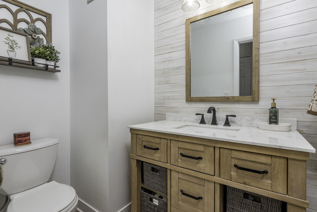 419 Northgate Road Lindenhurst, IL 60046 - Photo 11 of 23 a bathroom with a granite countertop toilet sink and mirror