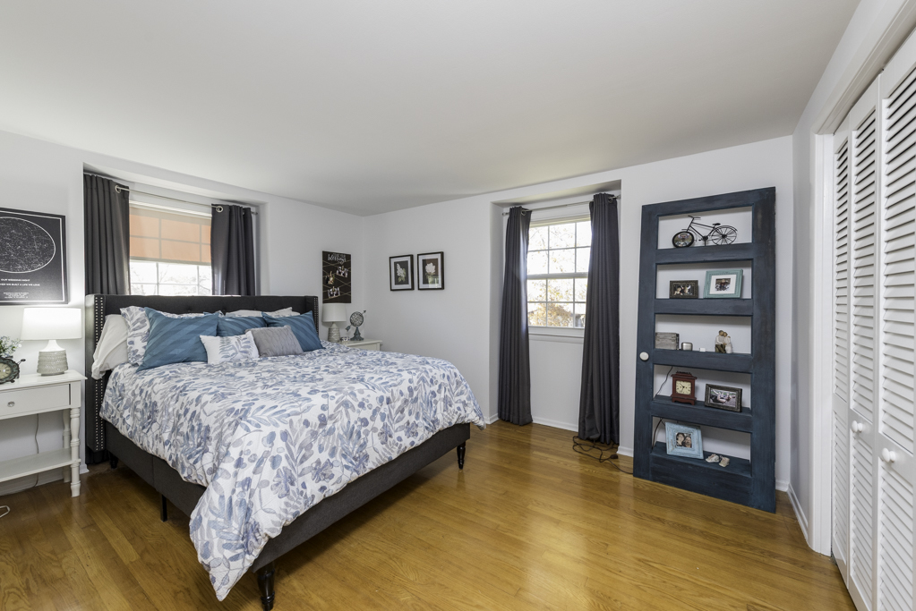 419 Northgate Road Lindenhurst, IL 60046 - Photo 12 of 23 a bedroom with a bed and walk in closet with window