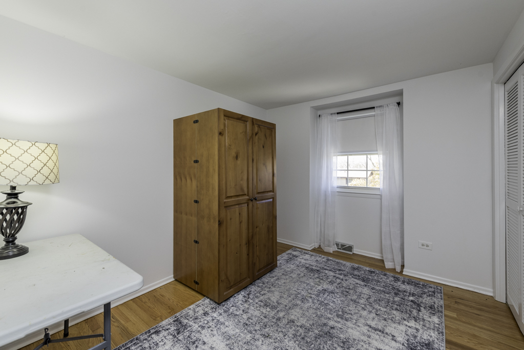 419 Northgate Road Lindenhurst, IL 60046 - Photo 16 of 23 a view of a room with wooden floor and bathroom
