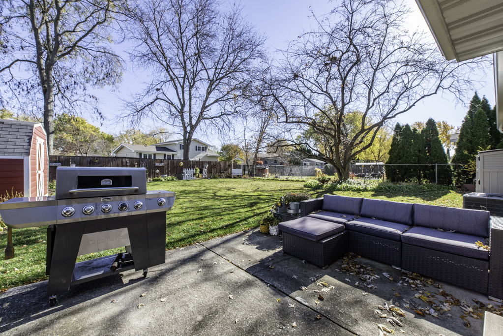 419 Northgate Road Lindenhurst, IL 60046 - Photo 22 of 23 a view of a patio with couches fire pit and a table and chairs