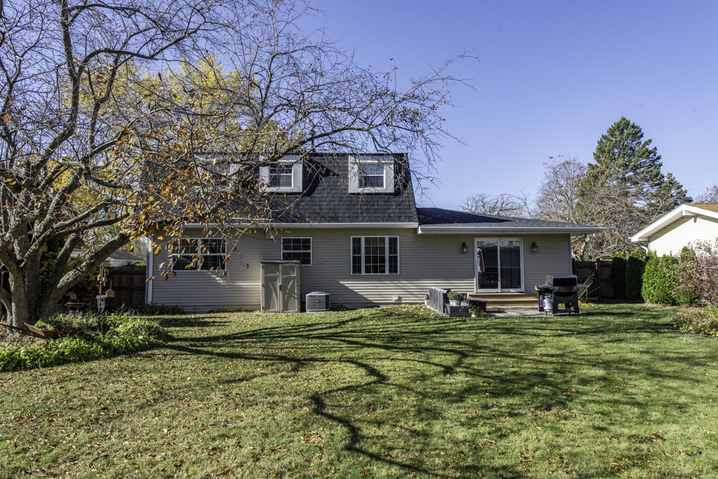 419 Northgate Road Lindenhurst, IL 60046 - Photo 23 of 23 a front view of house with yard and trees in the background