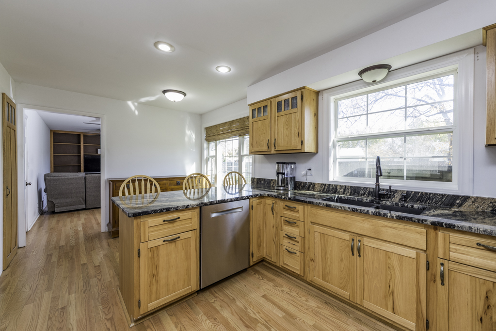 419 Northgate Road Lindenhurst, IL 60046 - Photo 5 of 23 a kitchen with granite countertop a sink and cabinets