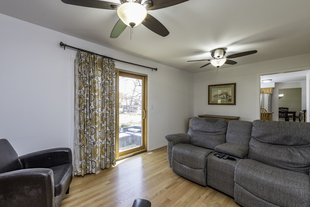 419 Northgate Road Lindenhurst, IL 60046 - Photo 10 of 23 a living room with furniture ceiling fan and a window