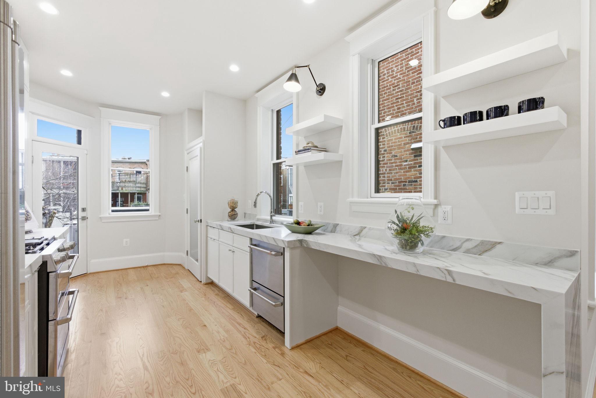 1319 East Capitol Street Southeast Washington, DC 20003 - Photo 12 of 46 a spacious bathroom with a granite countertop sink mirror and vanity