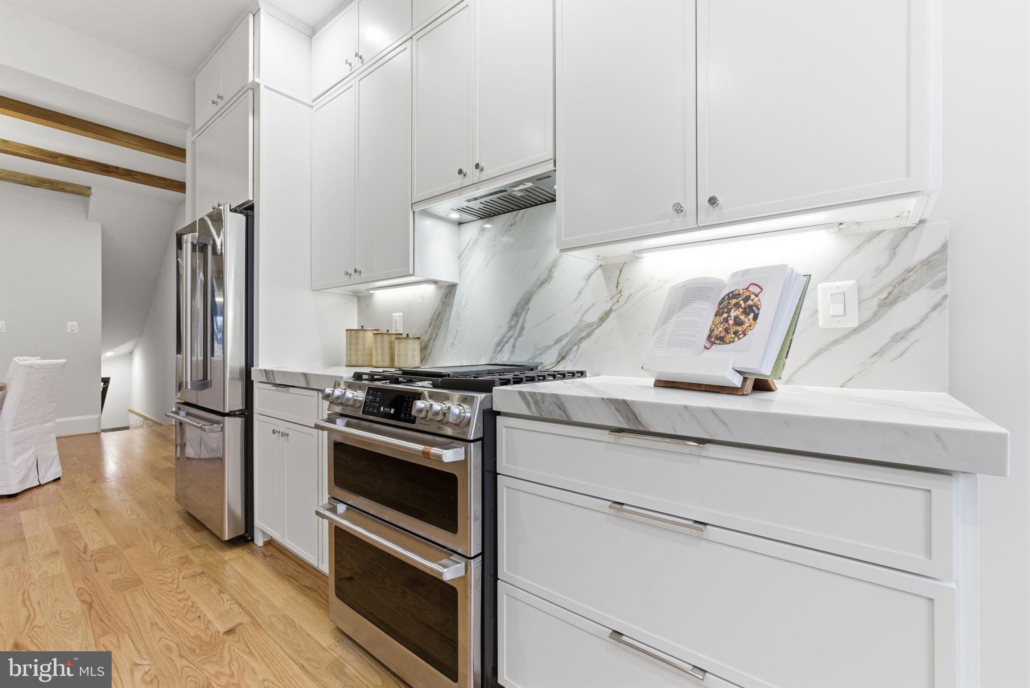 1319 East Capitol Street Southeast Washington, DC 20003 - Photo 15 of 46 a kitchen with a stove and a refrigerator