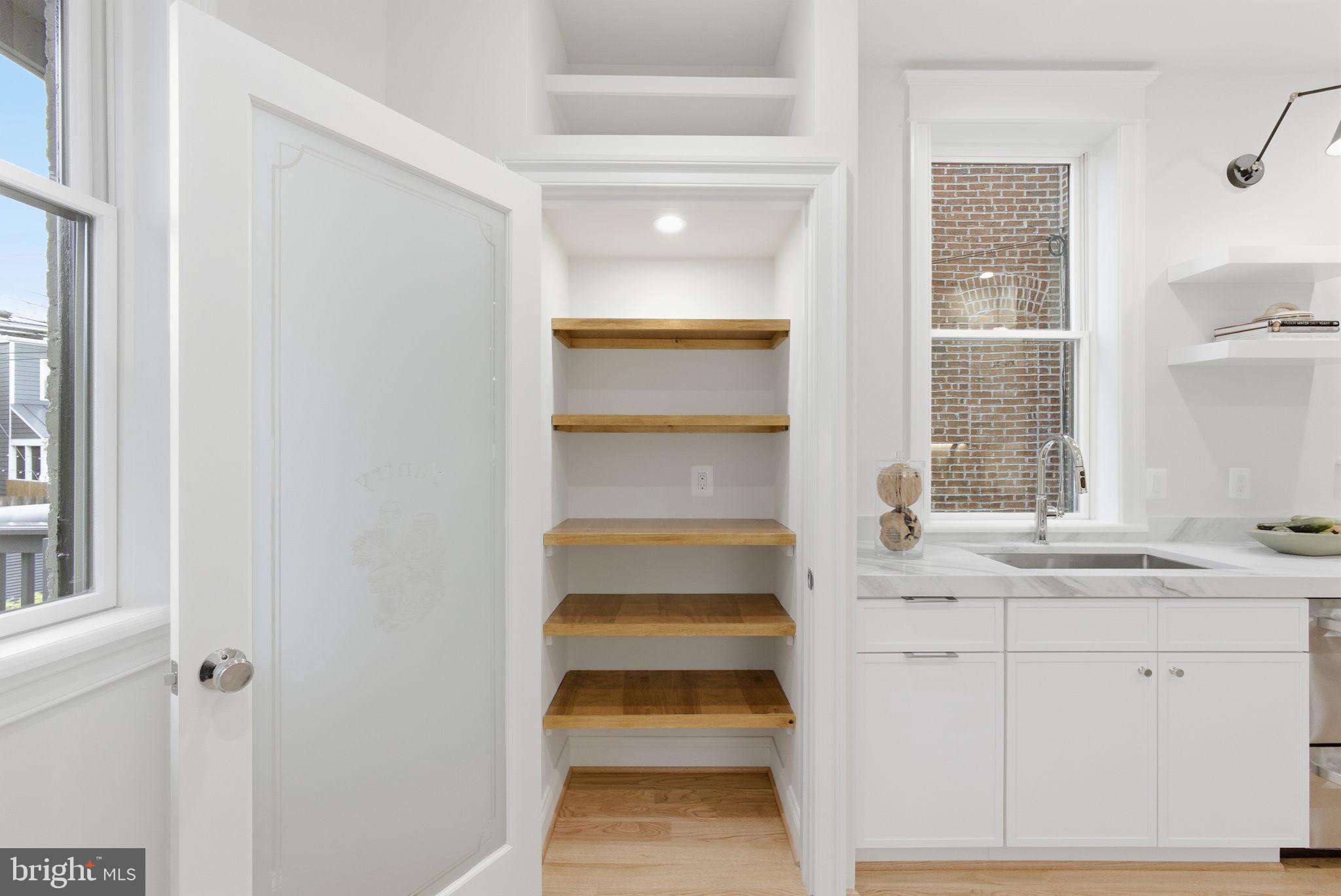 1319 East Capitol Street Southeast Washington, DC 20003 - Photo 17 of 46 a bathroom with a sink and a window