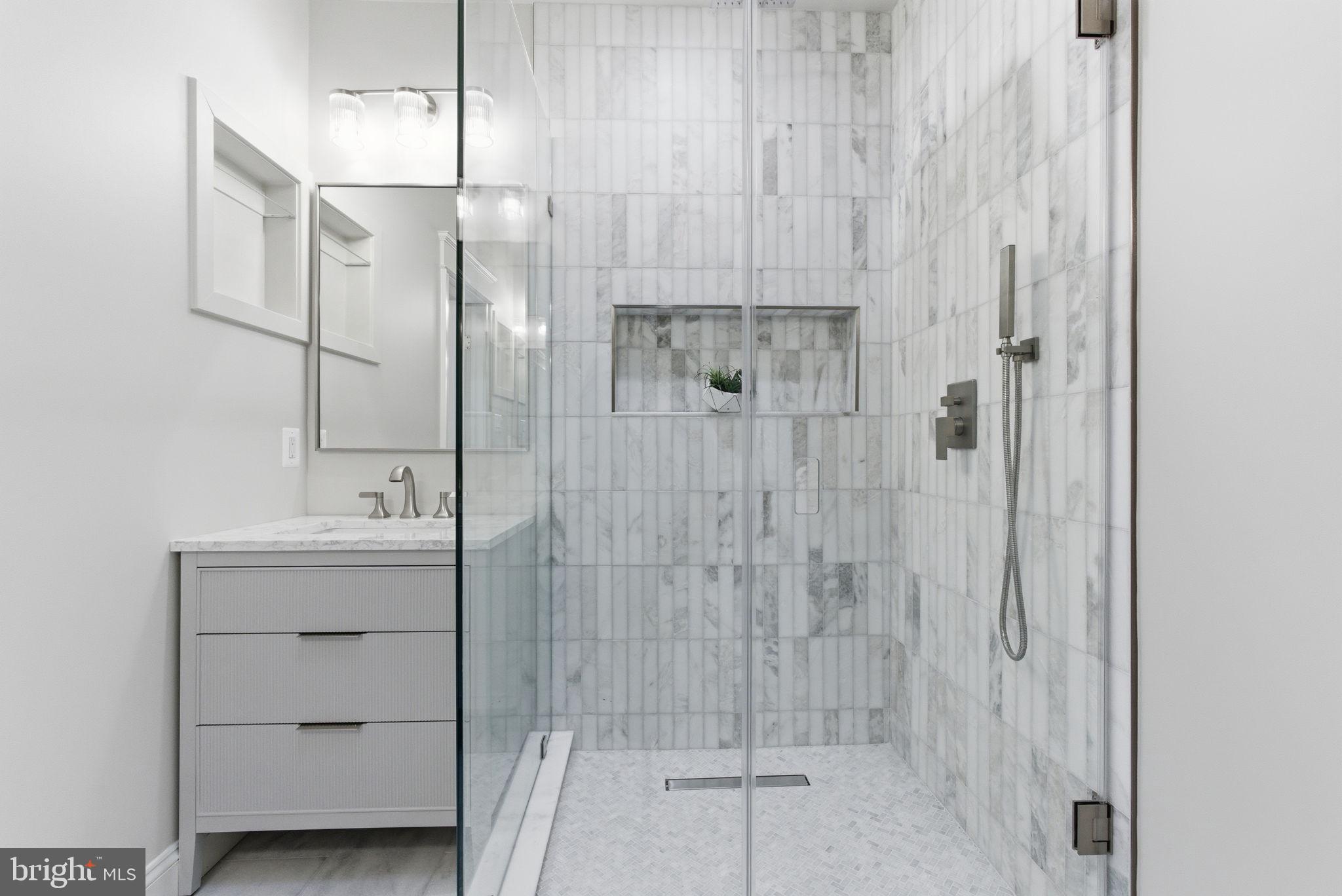 1319 East Capitol Street Southeast Washington, DC 20003 - Photo 20 of 46 a bathroom with a shower and a sink