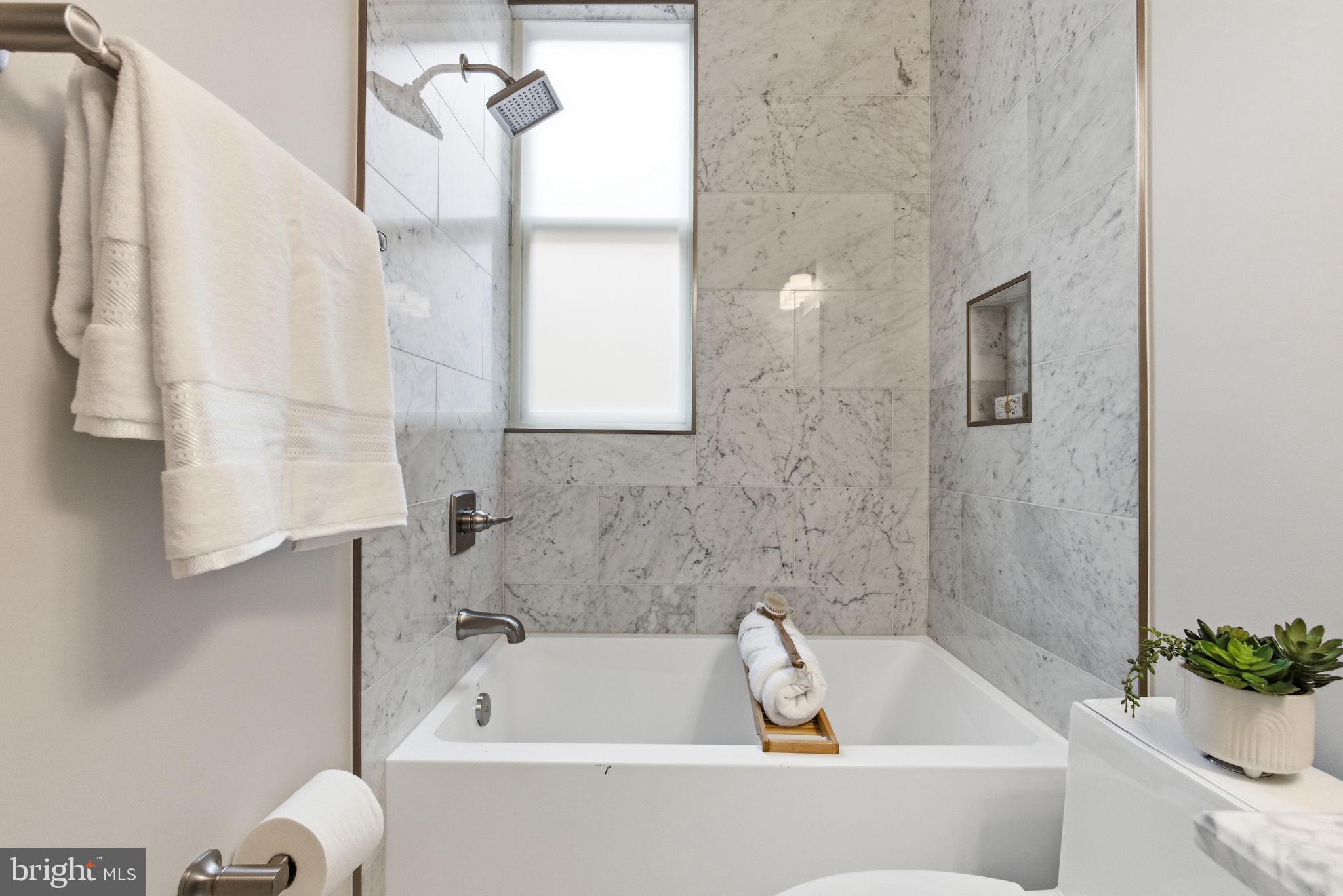 1319 East Capitol Street Southeast Washington, DC 20003 - Photo 27 of 46 a bathroom with a tub and shower