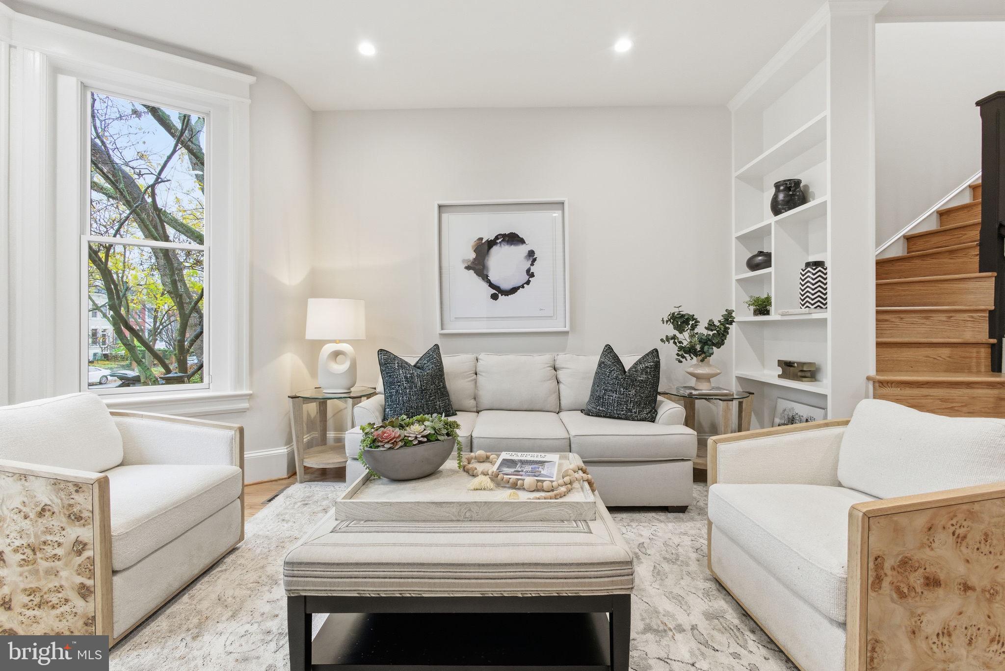 1319 East Capitol Street Southeast Washington, DC 20003 - Photo 4 of 46 a living room with furniture and a large window