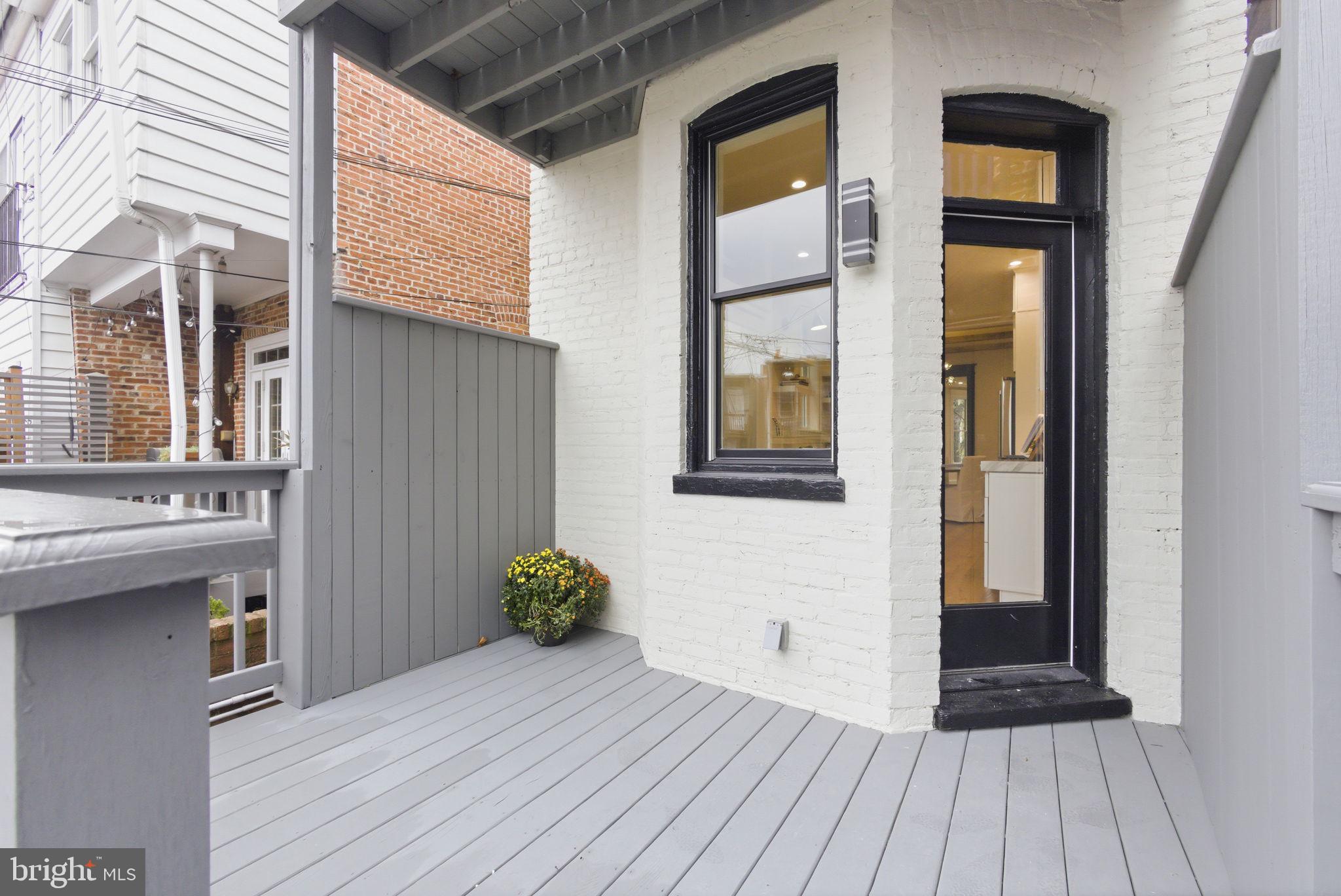 1319 East Capitol Street Southeast Washington, DC 20003 - Photo 41 of 46 a view of a house with a door and wooden floor
